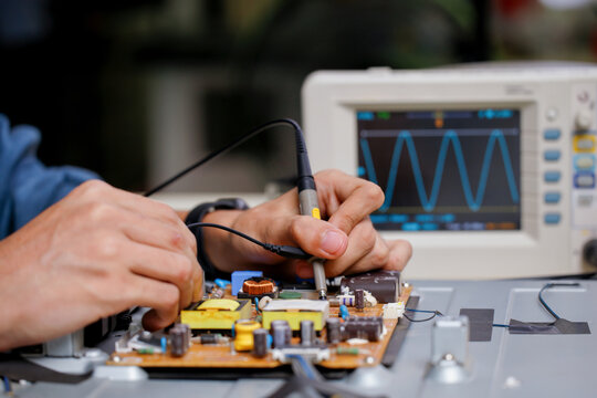 Electronics technician, electronic engineering electronic repair,electronics measuring and testing, repair and maintenance concepts.