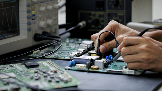 Electronics technician, electronic engineering electronic repair,electronics measuring and testing, repair and maintenance concepts.