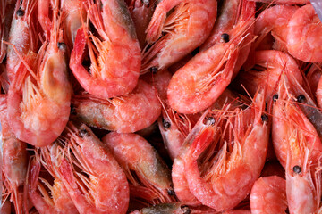 Frozen boiled shrimps. Seafood product. Full frame. Food background. Top view