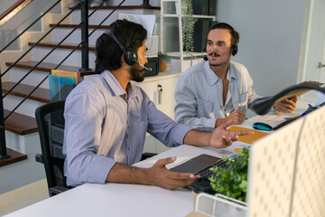 Portrait of young business friends gathered in a modern office conference room and worked as a team
