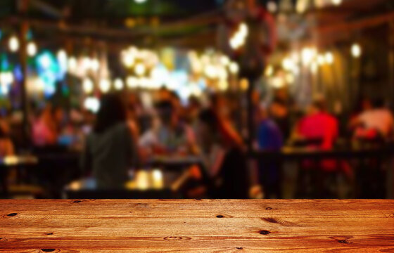 Wooden Table Top On Blur Restaurant Background.For Montage Product Display Or Design Key Visual Layout.View Of Copy Space.