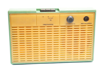 Old transistor radio isolated on white English translation: programs, volume, tape recorder...