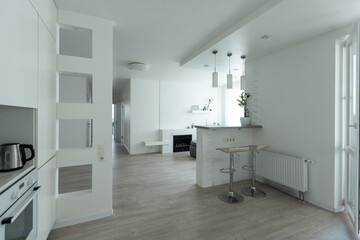 contemporary living room with open concept view through to dining room kitchen and a marble...
