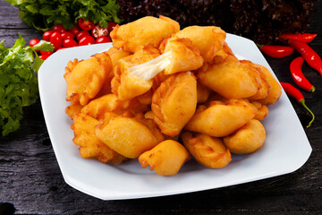 angu pastry stuffed with cheese, Brazilian snack