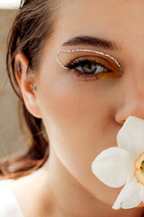close up portrait of a girl's face with makeup