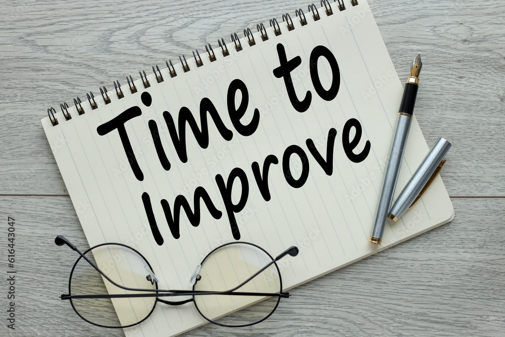 Poster an open notebook with the text time to improve.glasses and a pen are on the notebook. time to improv