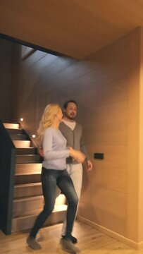 The beautiful couple have rest at wooden house. slow motion