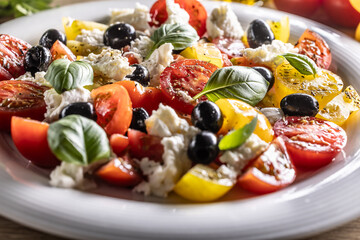 Vegetable food with mozzarella cheese named Caprese salad