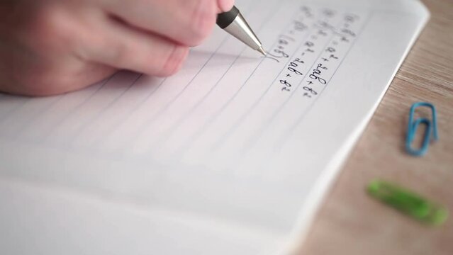 hand writing on a notebook