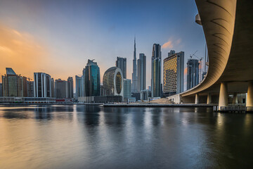 Dubai City skyline at sunset. Evening mood with a view of the skyscrapers of the business and...