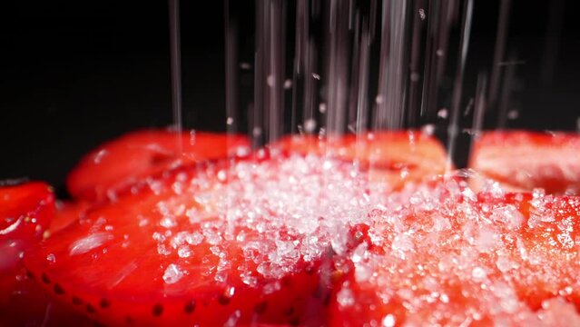 Diced ripe strawberries sprinkled with sugar. Dolly shot