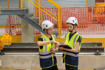 Engineer checks spare parts list and maintains mass transit locomotives in Asia