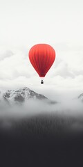 Obraz premium red hot air balloon flying over a snowy alaskan landscape - created using generative Ai tools