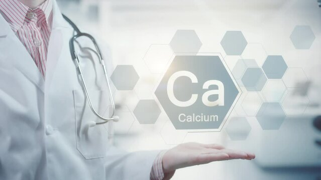 Pharmacy expert doctor showing symbol for the chemical element and mineral Calcium Ca. Clean abstract commercial background