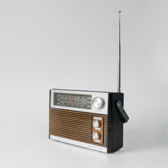 Authentic radio from the 70s. Front right view. Isolated on white background. Traces of time and...