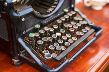 A vintage typewriter. Back in the 1900s, typing machines were popular yet they saved time on...