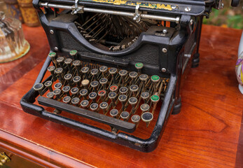 A vintage typewriter. Back in the 1900s, typing machines were popular yet they saved time on...