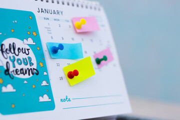 New year January business plan reminder mark the event day with note paper Thumbtack in calendar concept for busy timeline organize schedule, appointment and meeting reminder. planning for business.