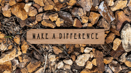 The sentence We believe in making a difference was written. Wooden concept studio shoot