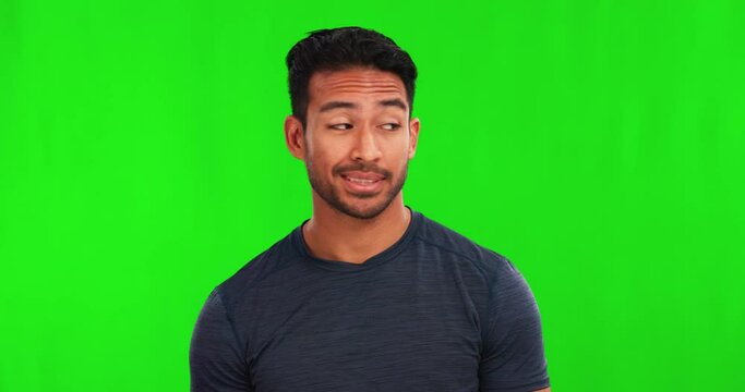 Confused, doubt and shrug with a man on a green screen background in studio for problem solving or uncertainty. Portrait, why and question with a young male person looking unsure on chromakey mockup