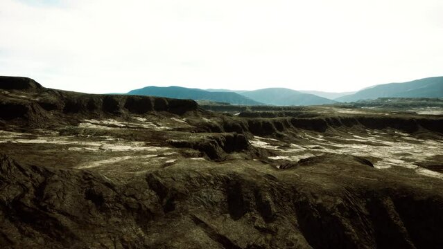 black volcanic basalt rock formations in the low light
