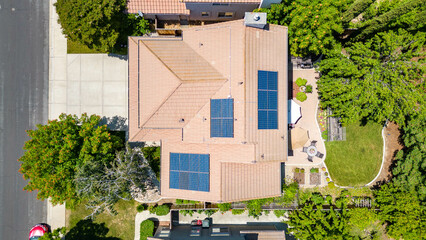Top down aerial view of a house with solar in a California neighborhood