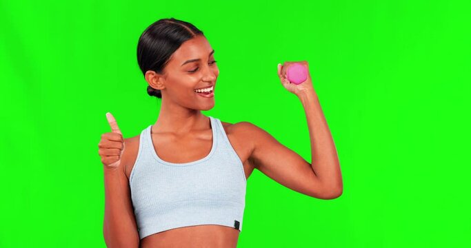 Fitness, green screen and woman with thumbs up in portrait, flexing arm with dumbbell and smile. Progress, winning and happy girl with success in sports, training and emoji for healthy exercise goal