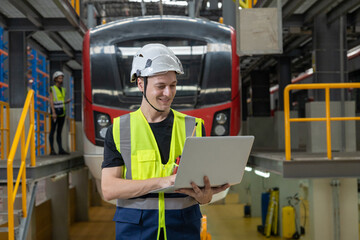 Portrait of Engineer train Inspect the Railway Electrification System track in depot of train