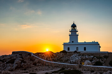 Fototapeta na wymiar Landscape of beautiful sunset at Cavallerie Lighthouse. Menorca, Spain