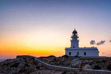 Fototapeta na wymiar Landscape of a beautiful sunset at Cavallerie Lighthouse. Menorca, Spain