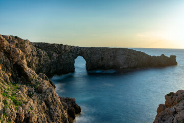 Sunset at Pont d’en Gil at the west coast of Menorca. Balearic Islands, Spain.