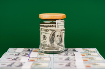 Dollar in a glass jar. Saving money. Valuable asset Financial wealth and time freedom Home Loan...