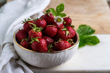 Bowl with fresh garden grown strawberries.