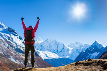 Victorious man Enjoying the Success in Himalayas Mountains, Nepal