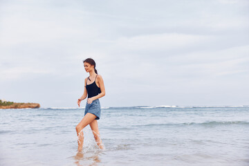 Fototapeta na wymiar woman beach female lifestyle sea summer sunset travel smile young running