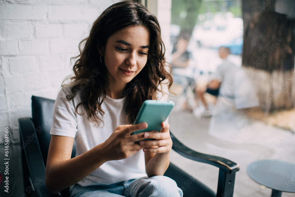 Poster caucasian female blogger using cellphone technology for social networking and chatting in social med