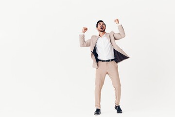 man winner beige suit running business victory happy smiling tie businessman