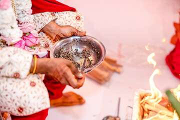 Fototapeta premium Indian Hindu wedding ritual hands close up