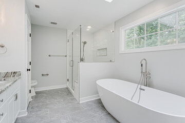 Luxury Clean Modern Bathroom Interior with Plant Styling and Double His and Her Vanity and Glass Shower
