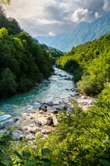 Fototapeta na wymiar Radiant Serenity: Sunlit Wonders of Soca Valley's Turquoise River