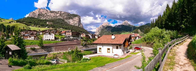 Poster  panorama of scenic  Val Gardena village ski resort in south Tyrol, surrounded by Alps mountains Dolomites,  northern Italy. © Freesurf