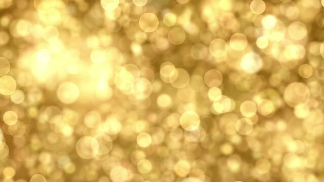 Abstract Christmas background of a blurred bokeh of animated golden flickering light particles in a seamless loop