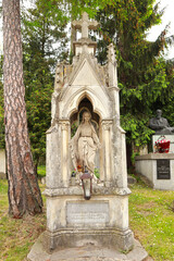 Fototapeta na wymiar Ancient tombstone at the famous Lychakiv Cemetery in Lviv, Ukraine