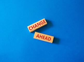 Change ahead symbol. Wooden blocks with words Change ahead. Beautiful blue background. Business and Change ahead concept. Copy space.