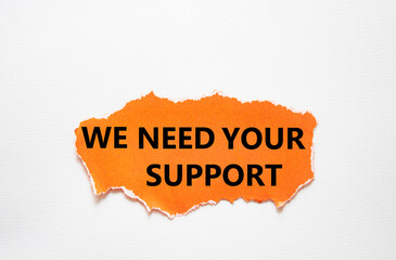 We need your support symbol. Torn orange paper with words We need your support. Beautiful white background. Business and We need your support concept. Copy space.