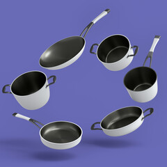 Set of flying stewpot, frying pan and chrome plated cookware on violet