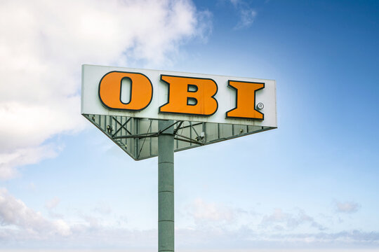Bratislava, Slovakia - 2023 April 13th: Branch logo of OBI against blue sky