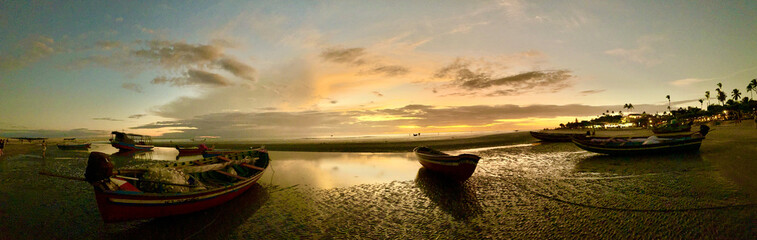 Brazil: wonderful sunset with fishermen's boats on Praia Principal de Jeri, the main beach of...