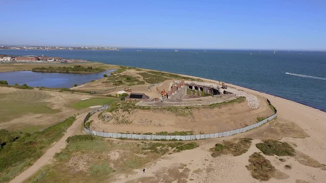 Fort Gilkicker a Palmerston Fort built between 1863 to 1871 on the Eastern end of Stokes by in Gosport to protect the entrance to Portsmouth harbour, aerial footage.