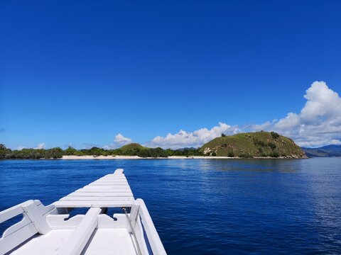 A boat cruise through the water of flores.